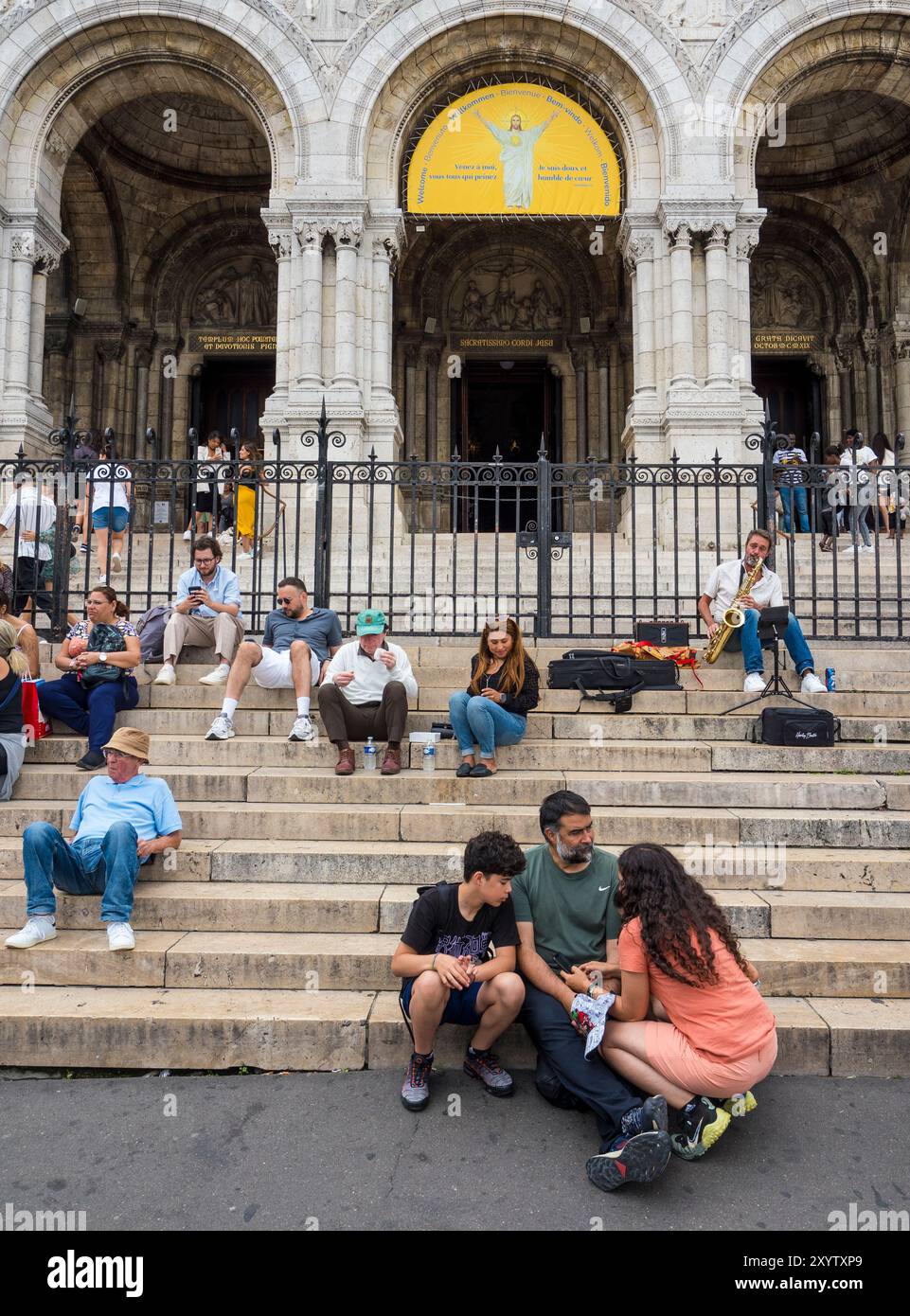 Tourists Resting on the Steps of Sacre Coeur, Montmartre, Paris, France, Europe, EU. Stock Photo