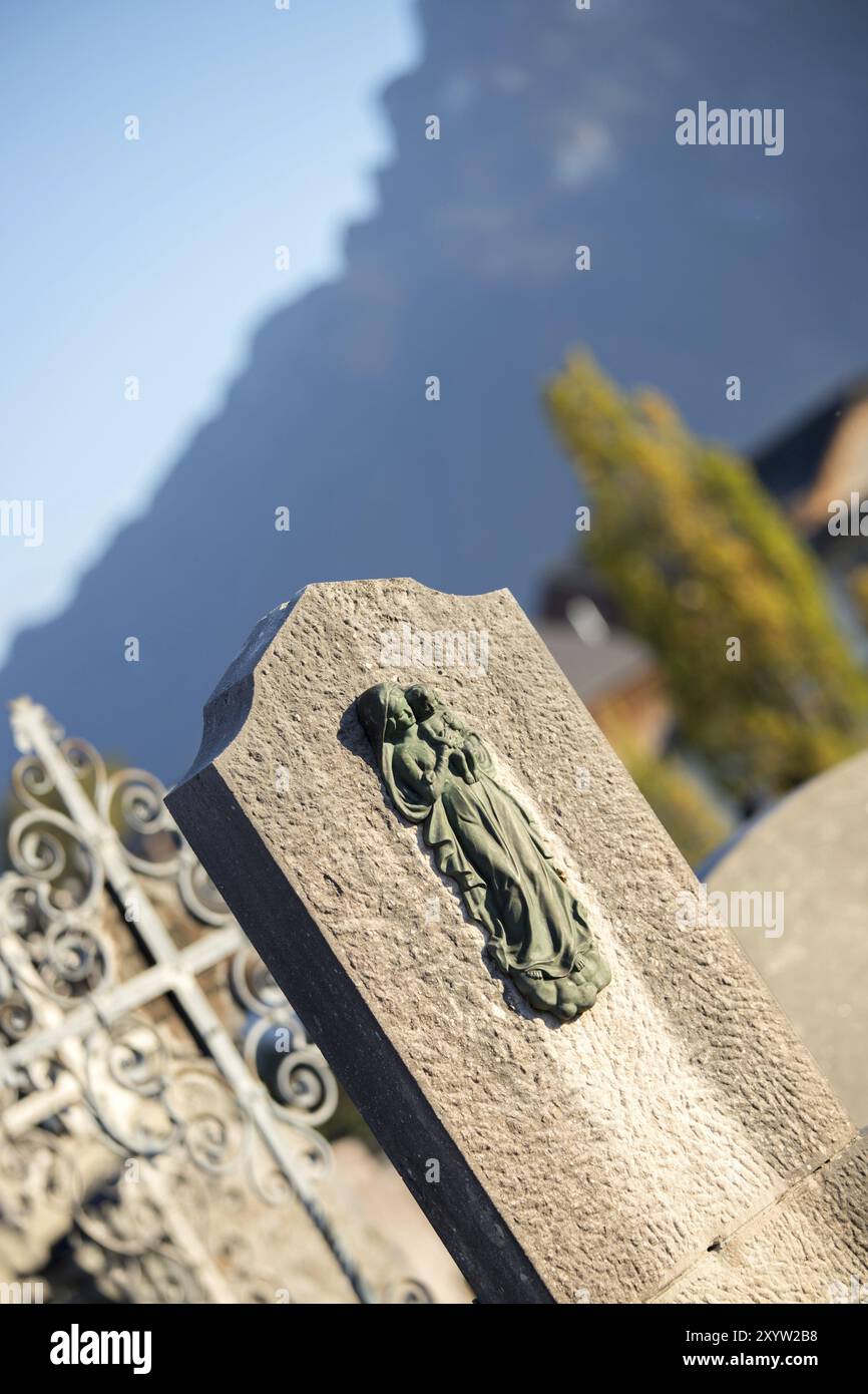 Iron sculpture of Maria on an tomb stone Stock Photo - Alamy