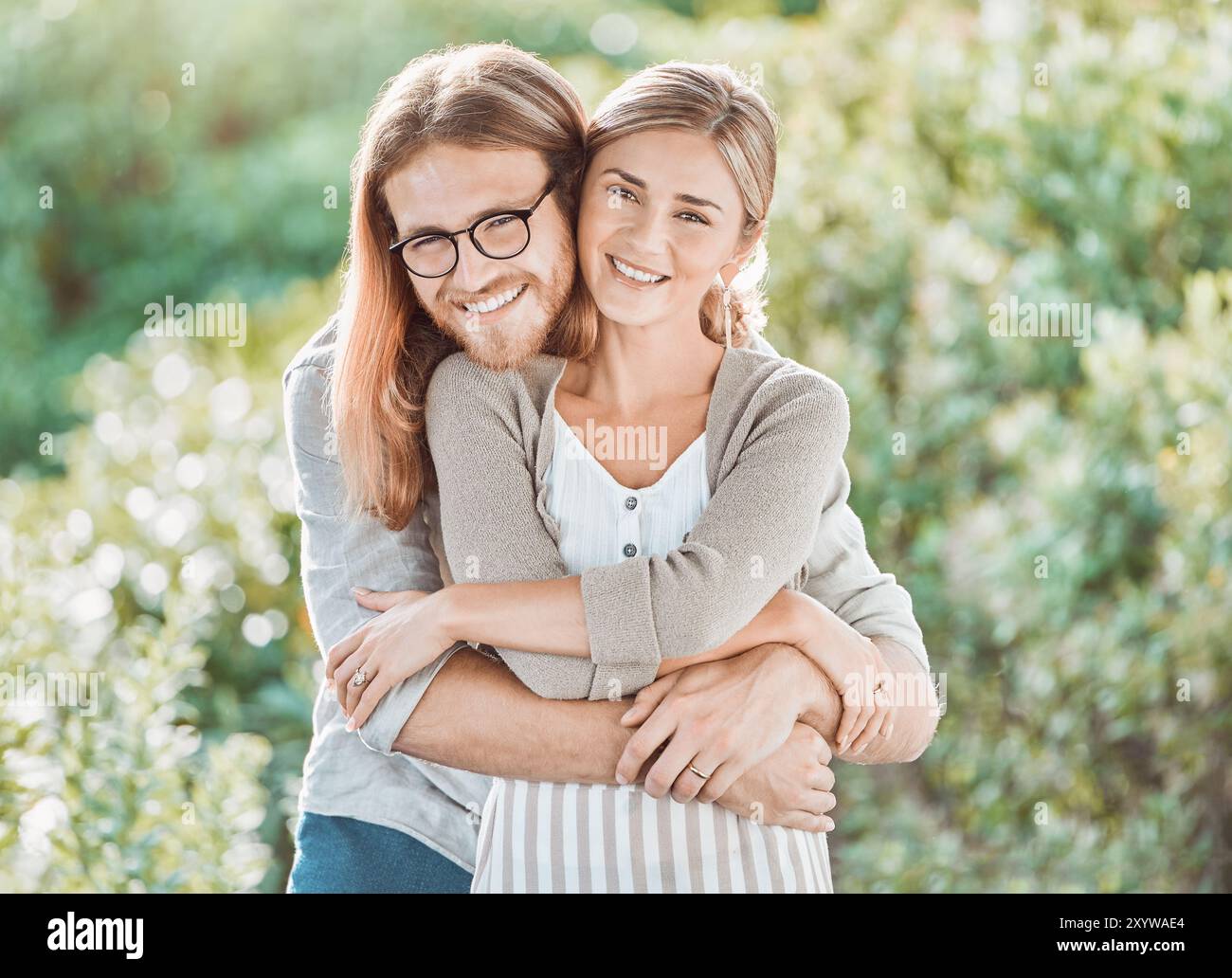 Couple, hug and smile for portrait in garden with care, bonding and ...