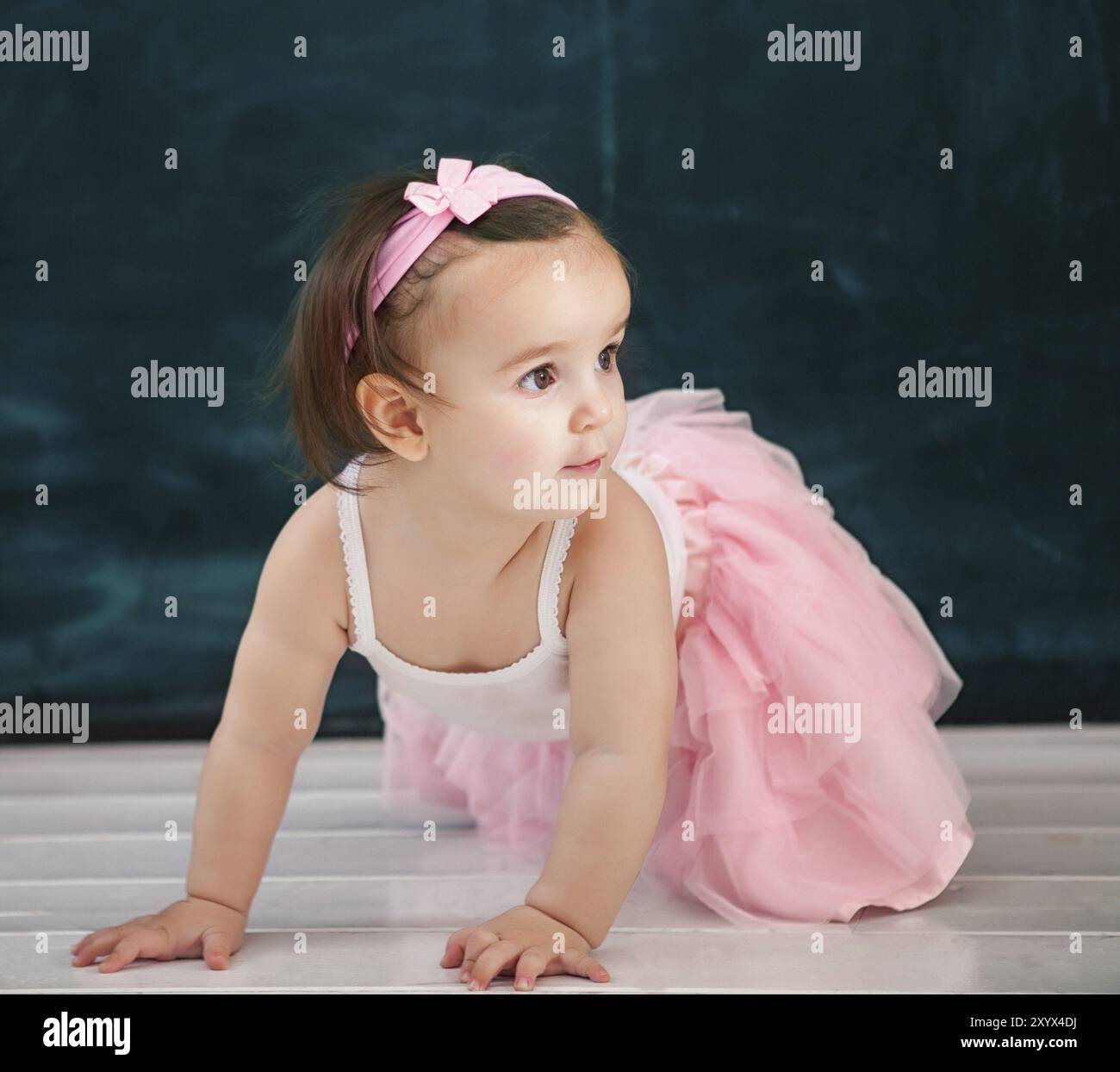 Portrait of the one year old baby wearing ballet suit indoor Stock Photo