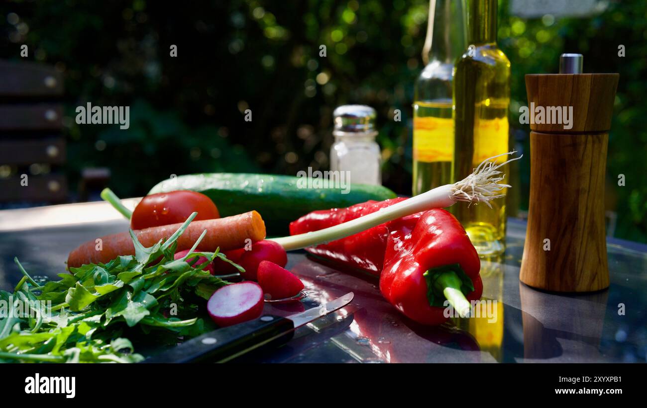 Various vegetables for a fresh salad on the table. Stock Photo