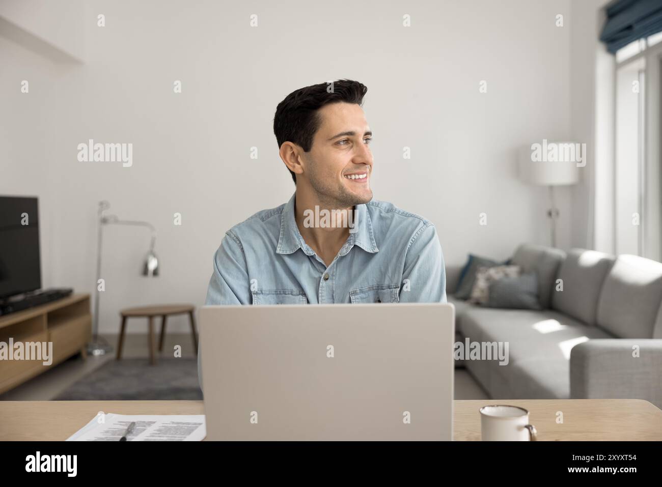 Happy Latin startup manager guy working at home Stock Photo