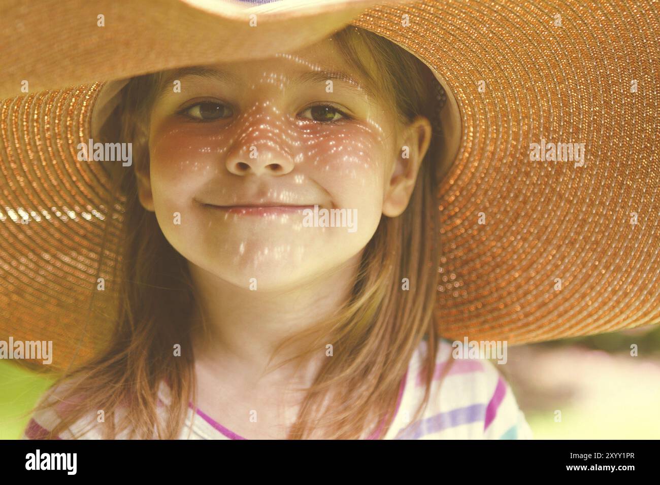 Portrait of the happy little girl blonde with long hair at sunset in ...