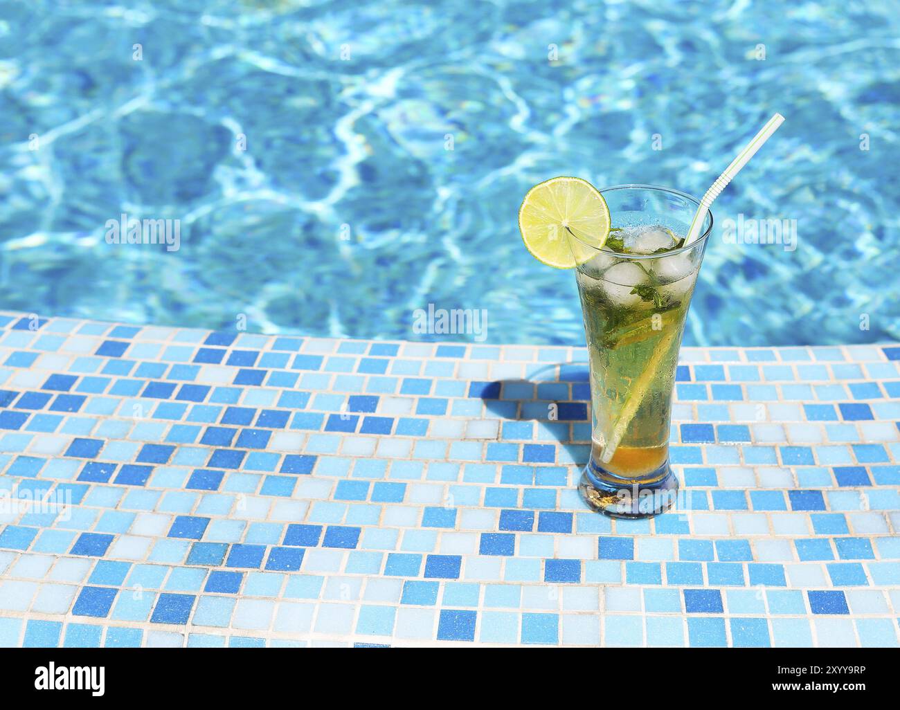 Glass of lemonade or mojito near swimming pool Stock Photo - Alamy