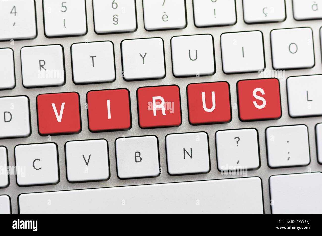 VIRUS writing on white keyboard Stock Photo