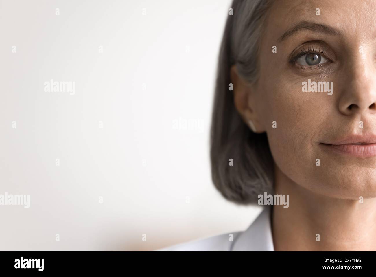 Mature closeup half of face hi-res stock photography and images - Alamy