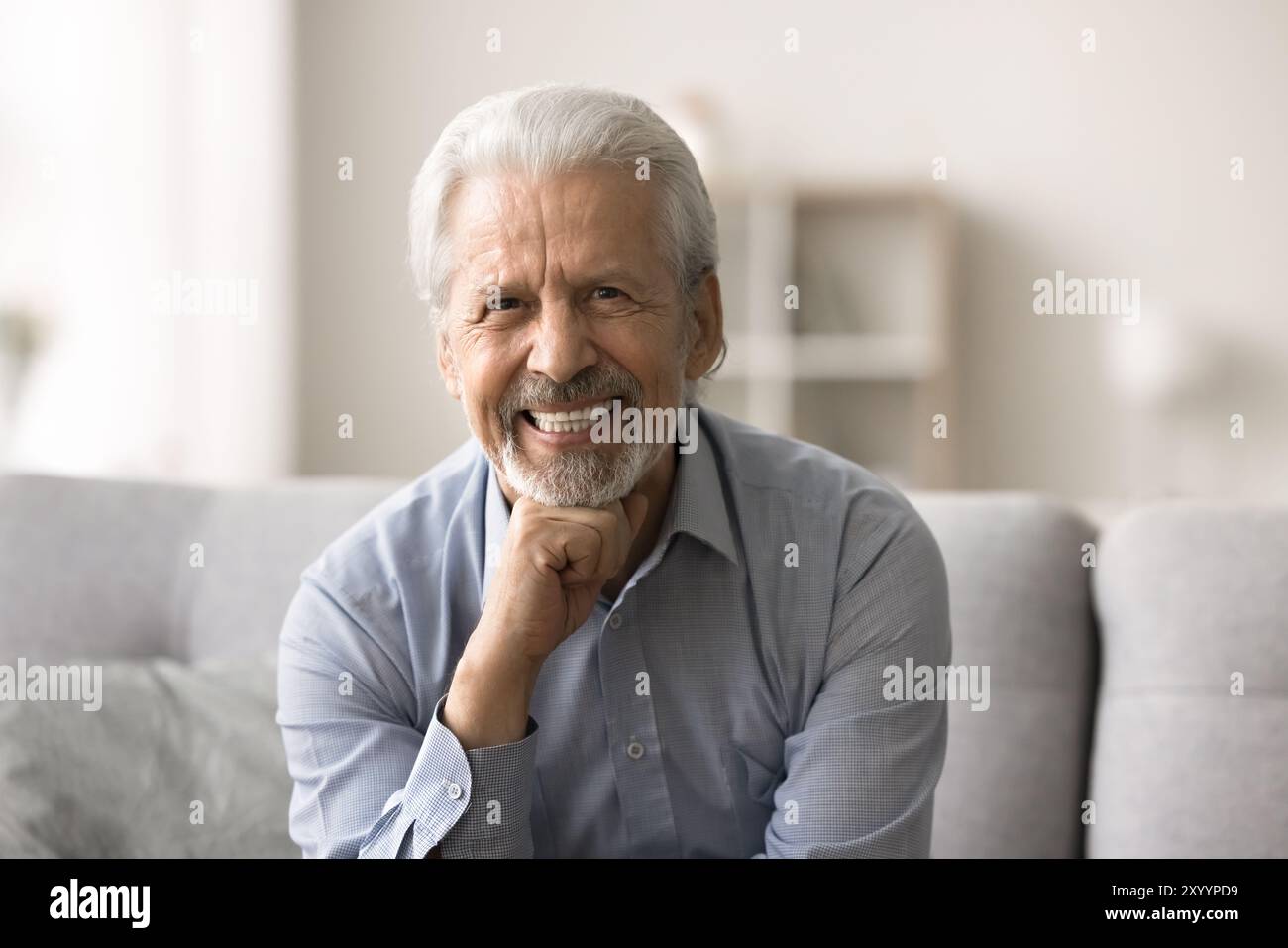 Head shot portrait satisfied mature man sitting on sofa Stock Photo - Alamy