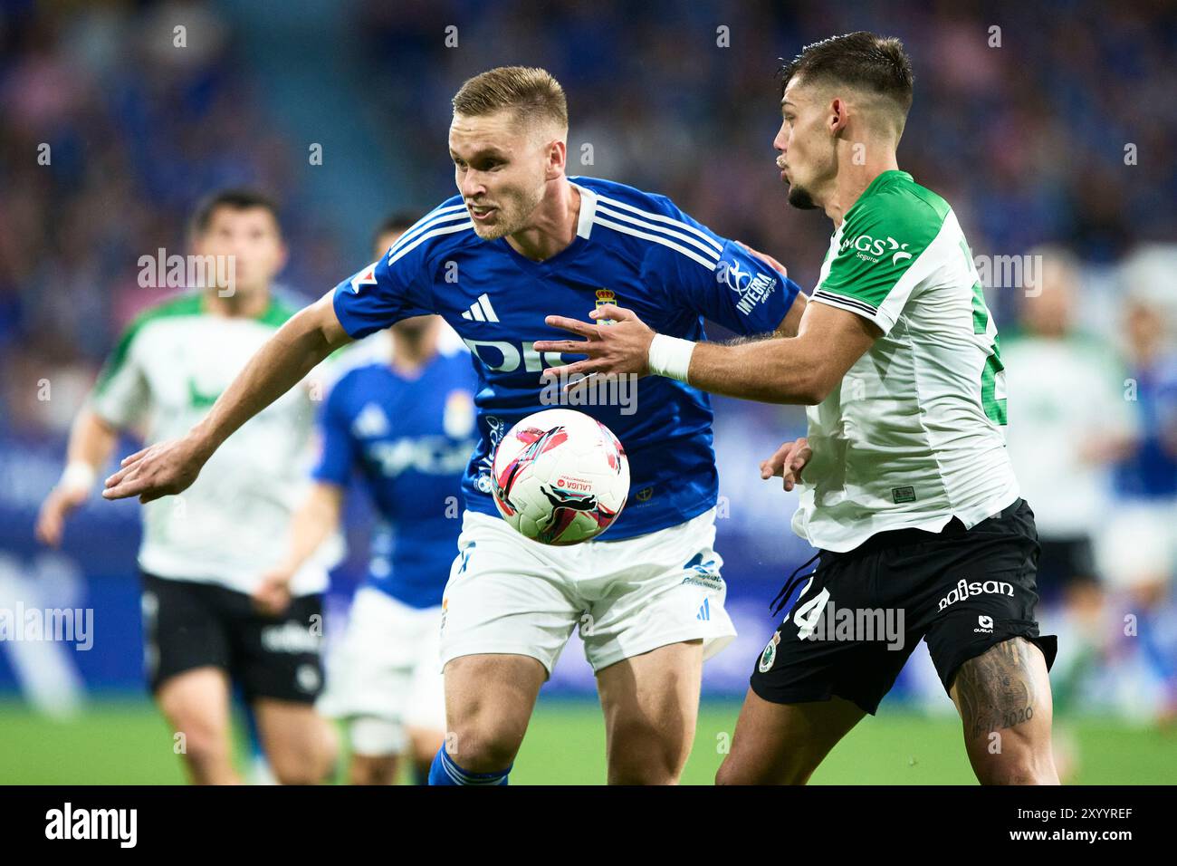 Alexandre Zurawski 'Alemao’ of Real Oviedo compete for the ball with Javi Montero of Real Racing Club during the LaLiga Hypermotion match between Real Stock Photo