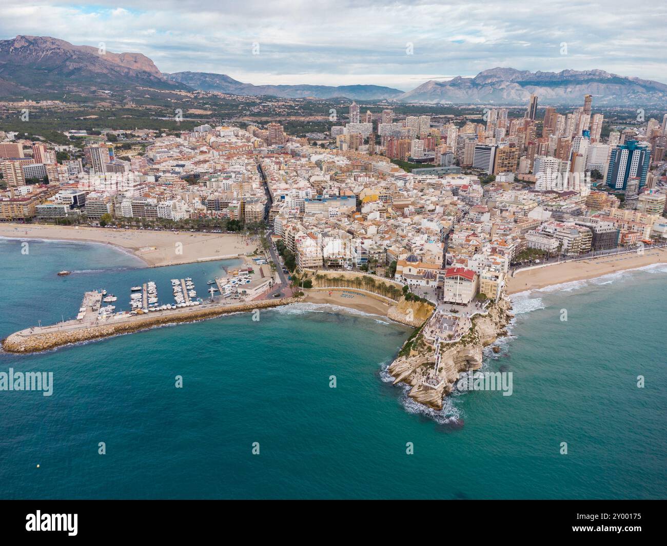 Aerial drone point of view of Benidorm city. Famous travel destination in Alicante province, Spain. Skyscrapers, mountains in background, Mediterranea Stock Photo