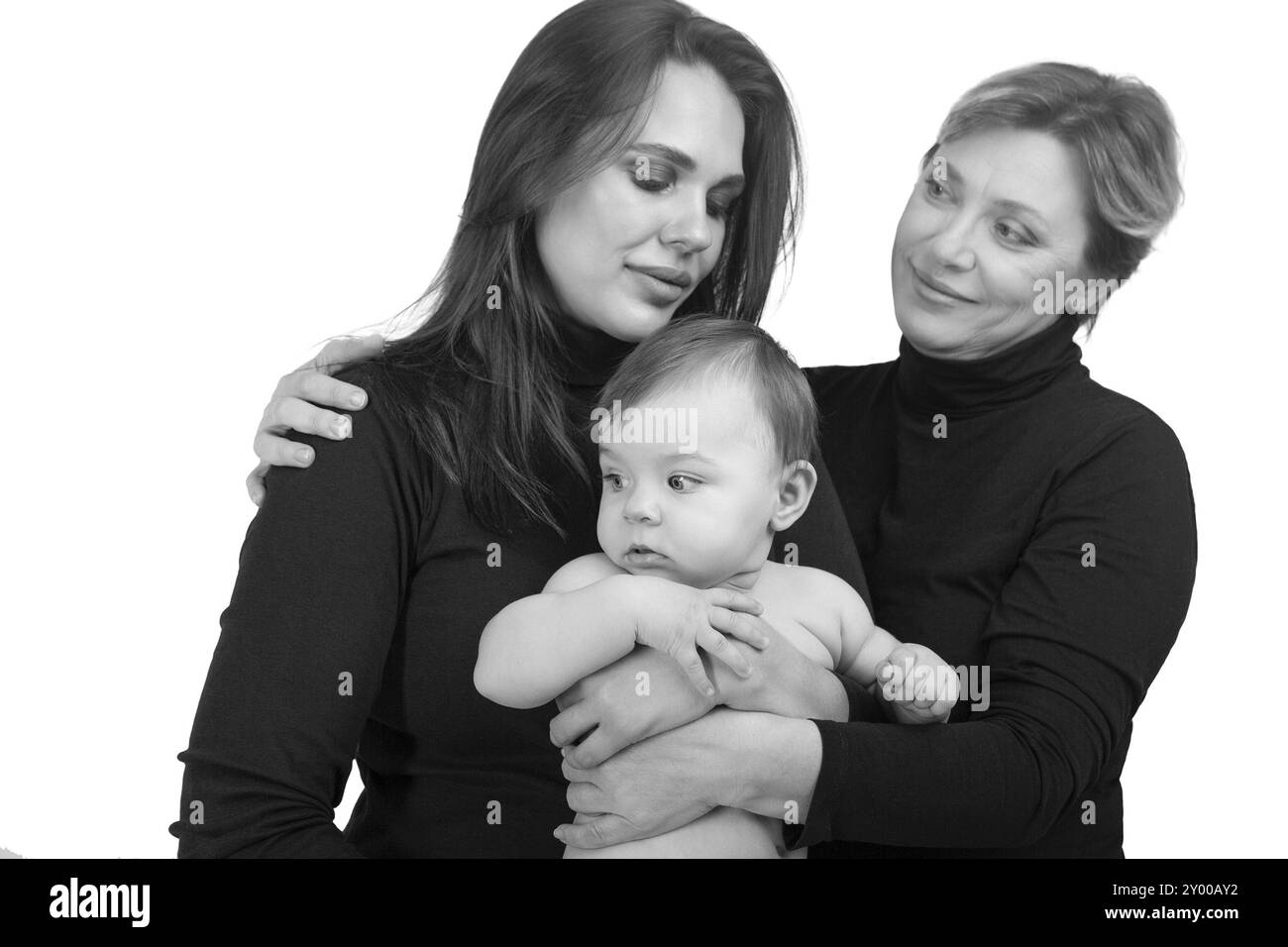 Grandmother, daughter and granddaughter on white portrait, happy family concept. Black and white Stock Photo