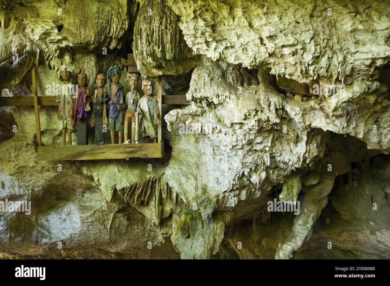 The scattered bones and effigies of the dead are seen in this burial ...
