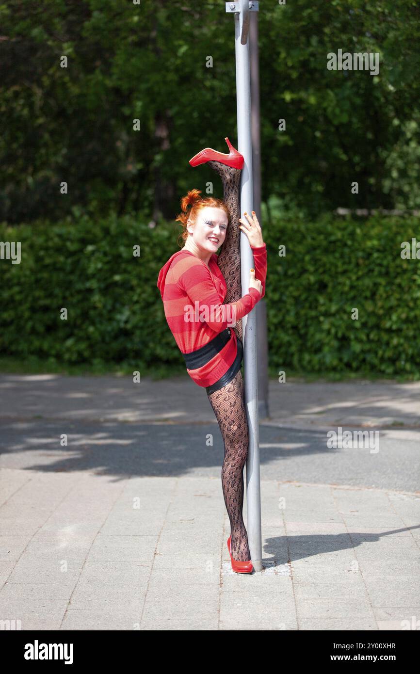Road acrobatics on a traffic sign Stock Photo - Alamy