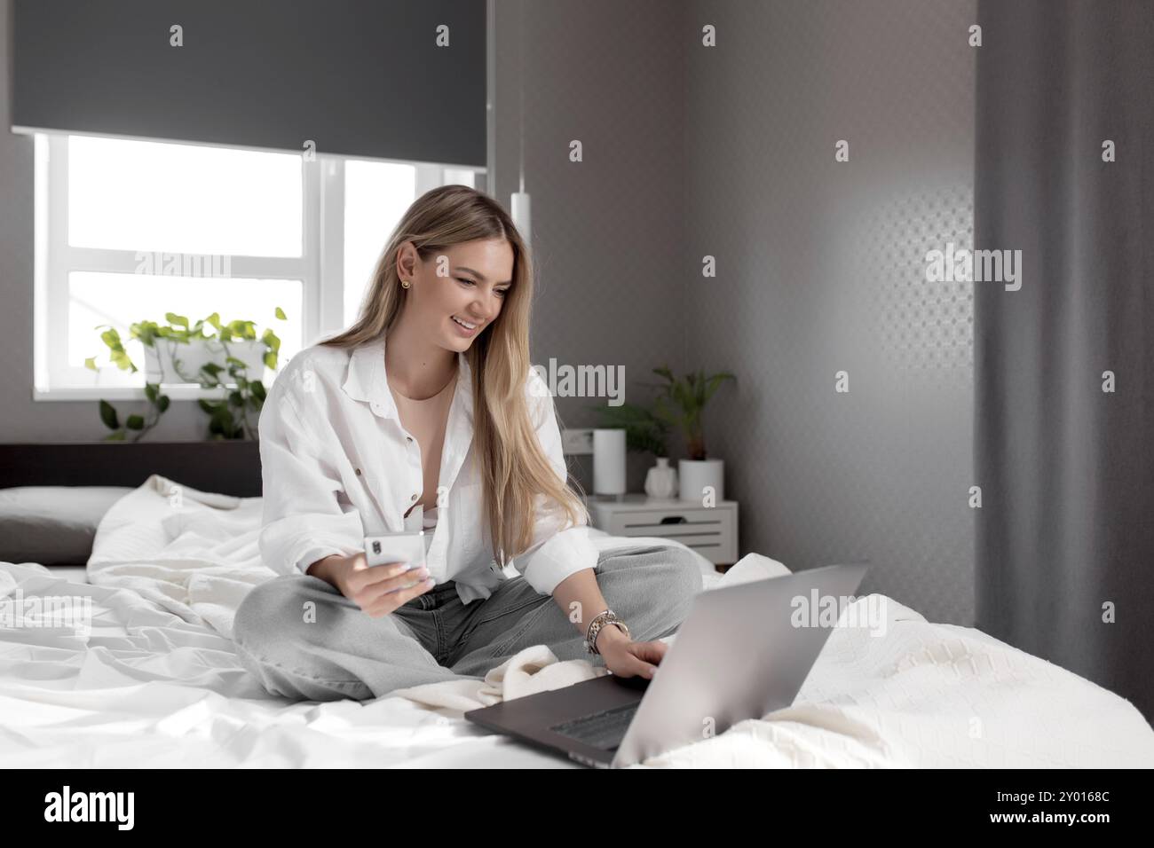 Smiling pretty girl sits in hi-res stock photography and images - Alamy