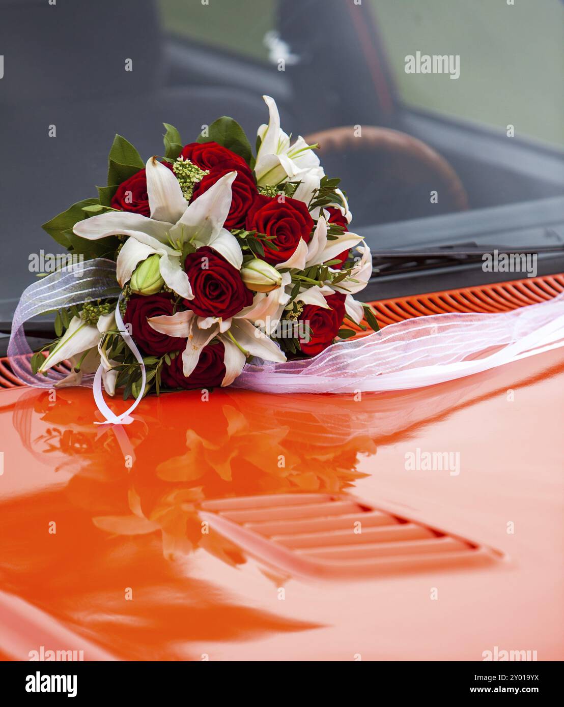 Bridal bouquet on a red bonnet Stock Photo - Alamy