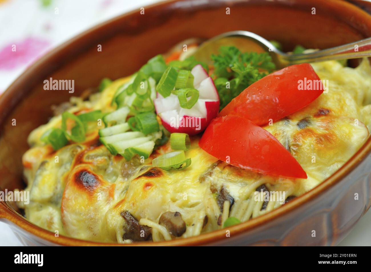 Casserole with mushrooms and noodles, topped with cheese Casserole with mushrooms and noodles with cheese Stock Photo