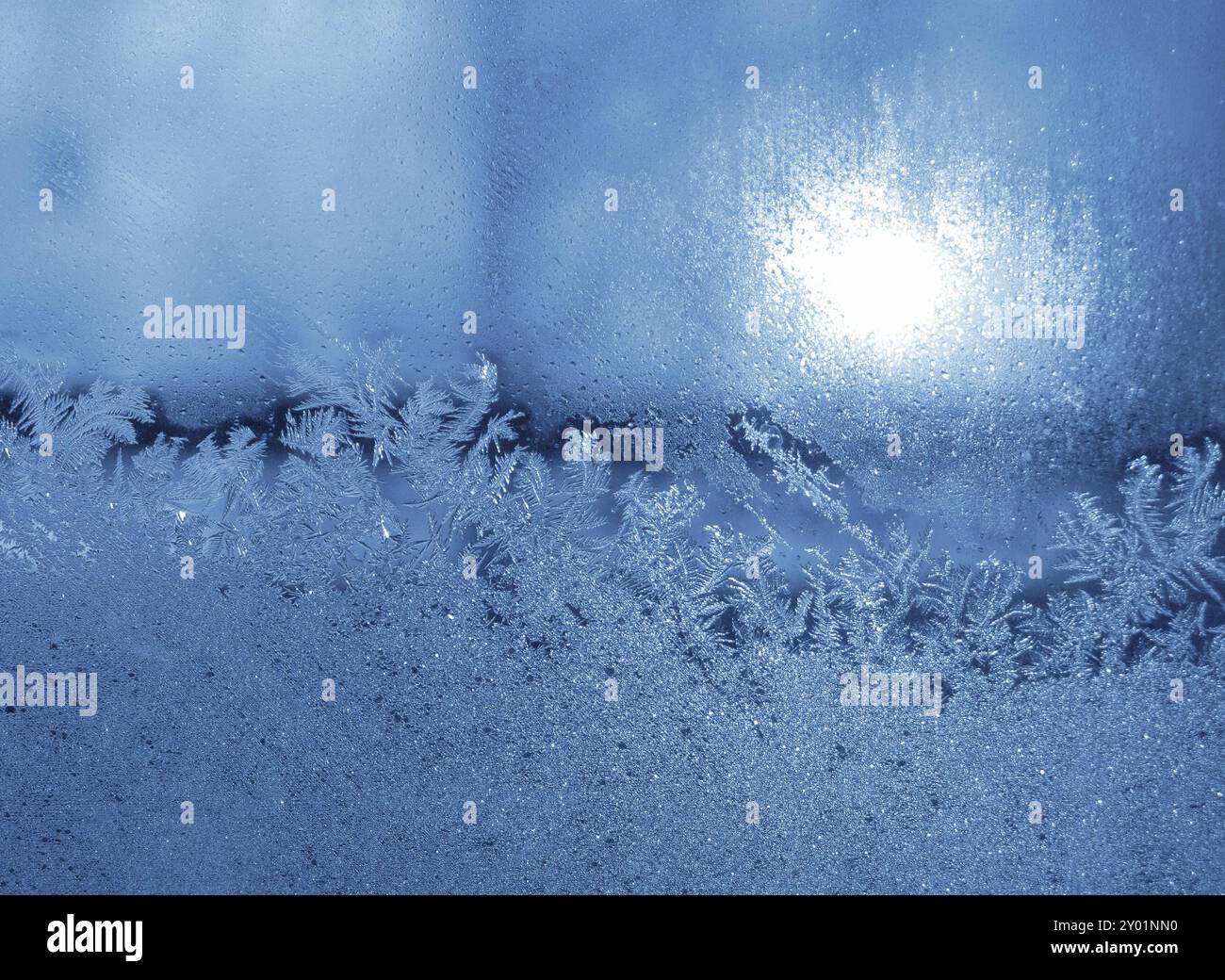 Frosty natural pattern and sun on winter window Stock Photo - Alamy