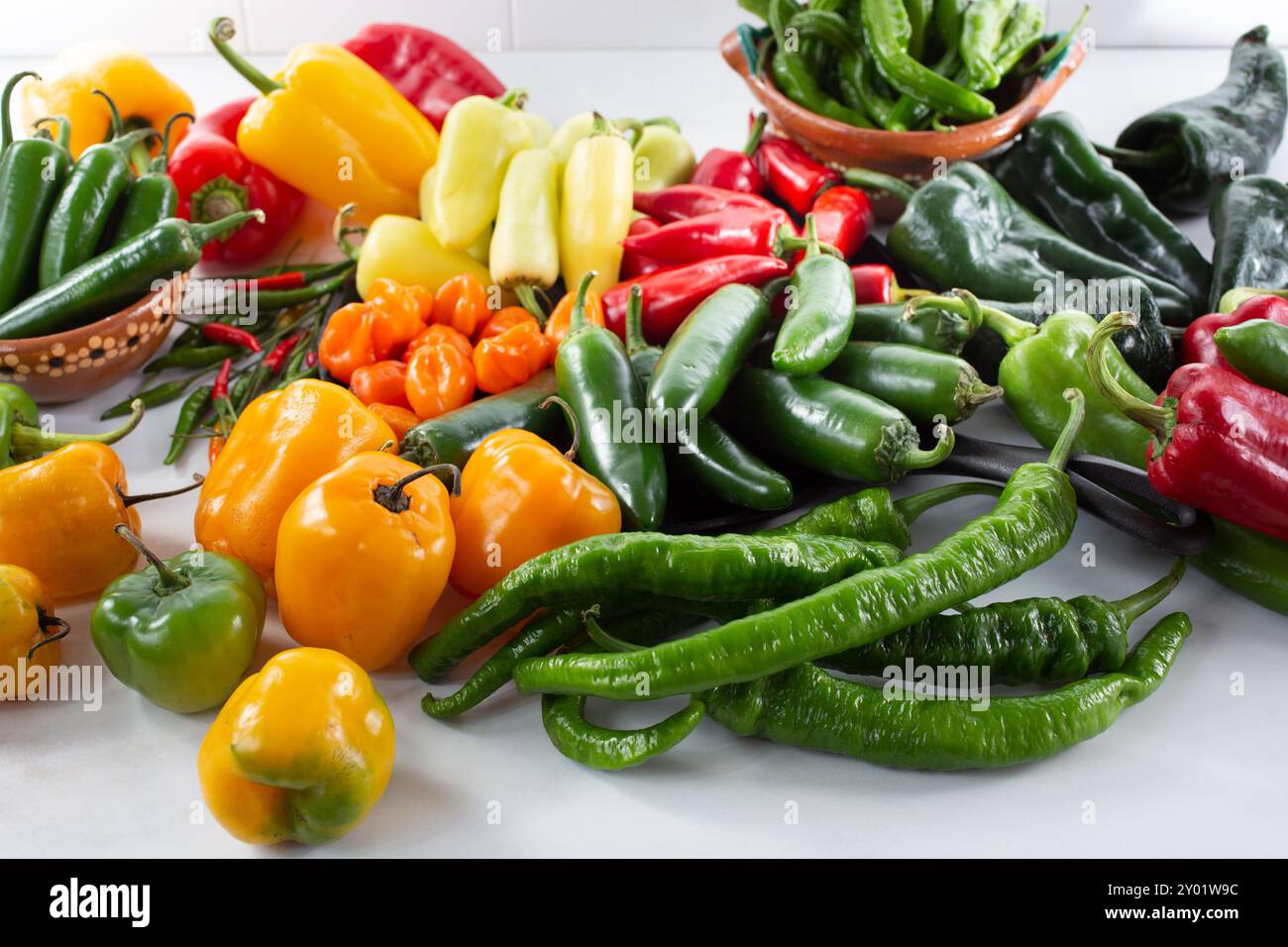 A view of a variety of chili peppers. Stock Photo