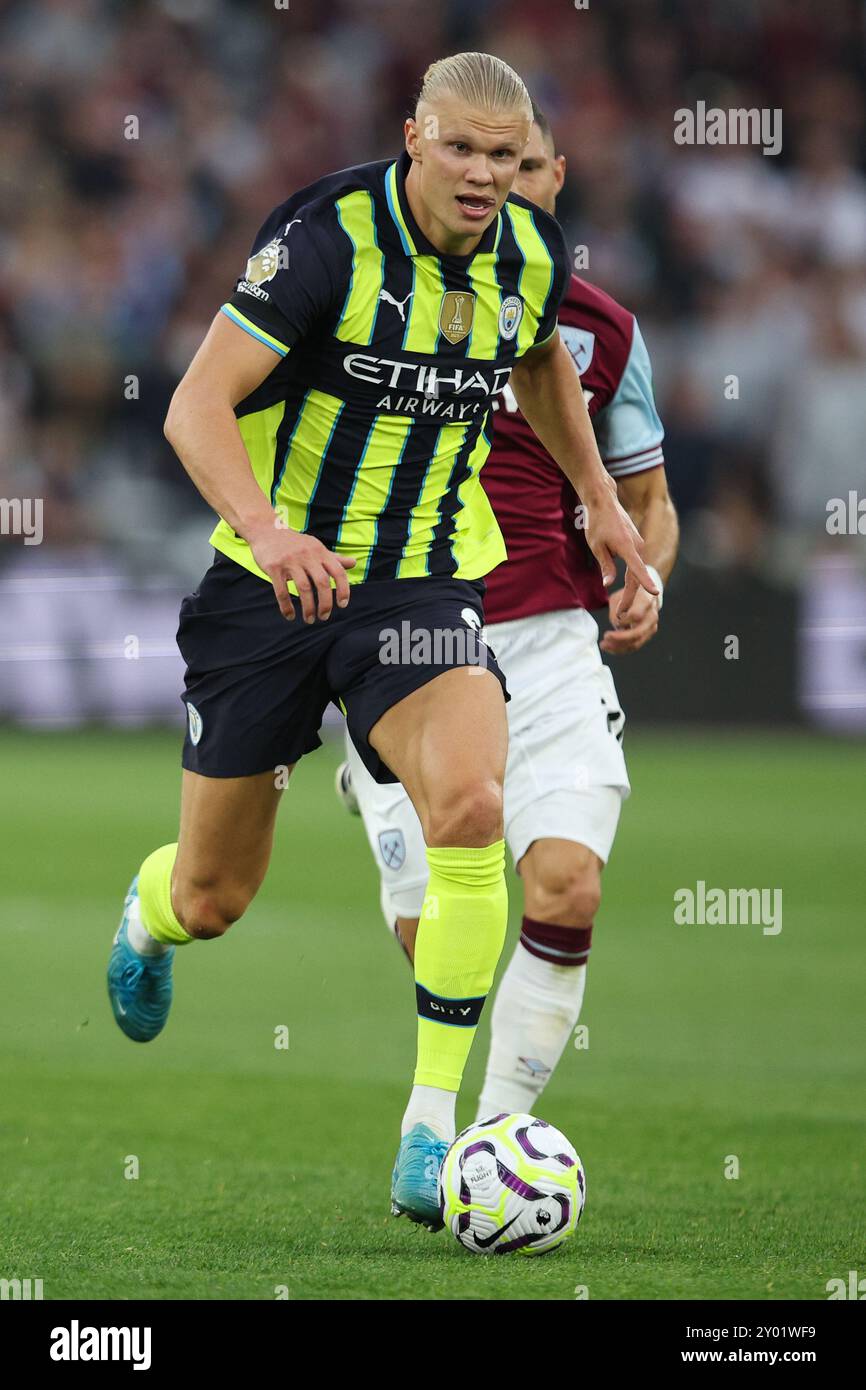 LONDON, UK - 31st Aug 2024:  Erling Haaland of Manchester City runs with the ball on the way to scoring his side’s third goal during the Premier League match between West Ham United and Manchester City at London Stadium  (Credit: Craig Mercer/ Alamy Live News) Stock Photo