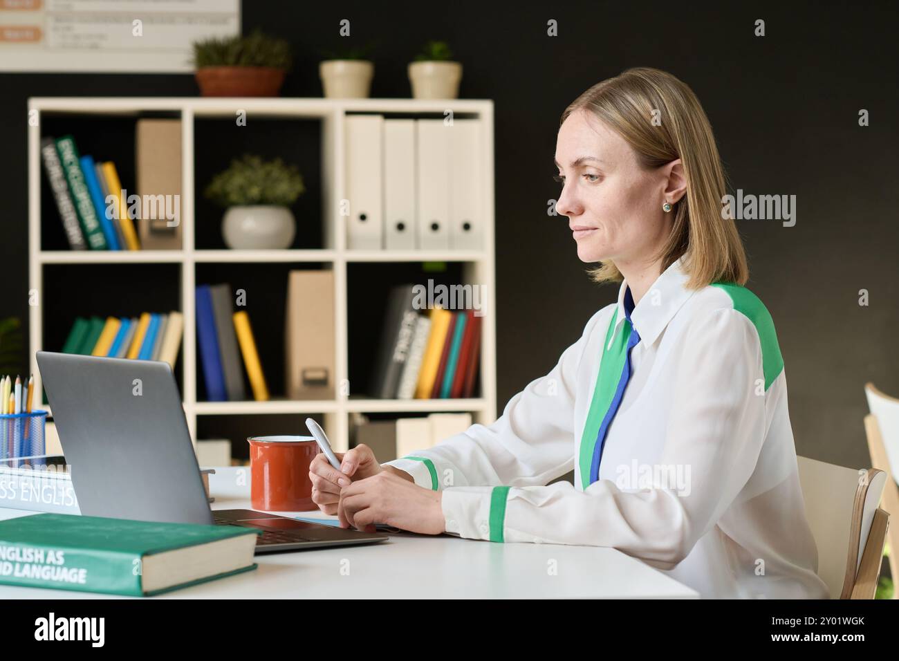 Woman using Laptop in Study Stock Photo