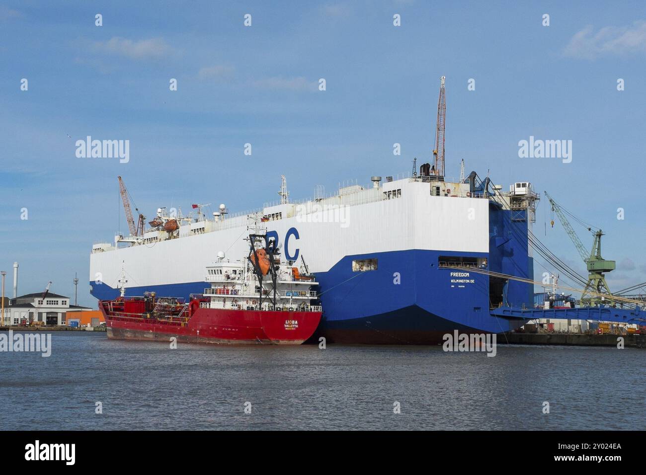 Vessel Freedom with crude oil vessel Lioba Valette in Bremerhaven. Vessel Freedom with crude oil vessel in Bremerhaven Stock Photo