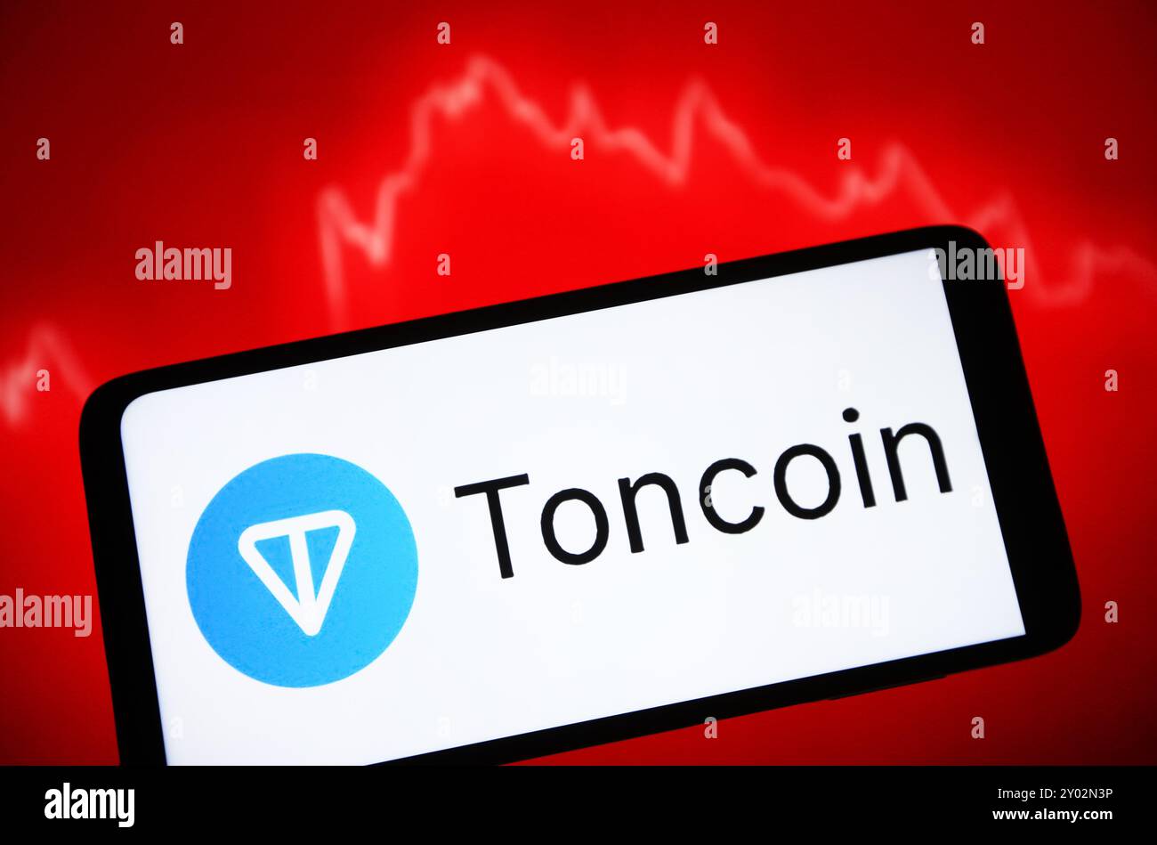 In this photo illustration, a Toncoin (TON) cryptocurrency logo is seen on  a smartphone screen Stock Photo - Alamy