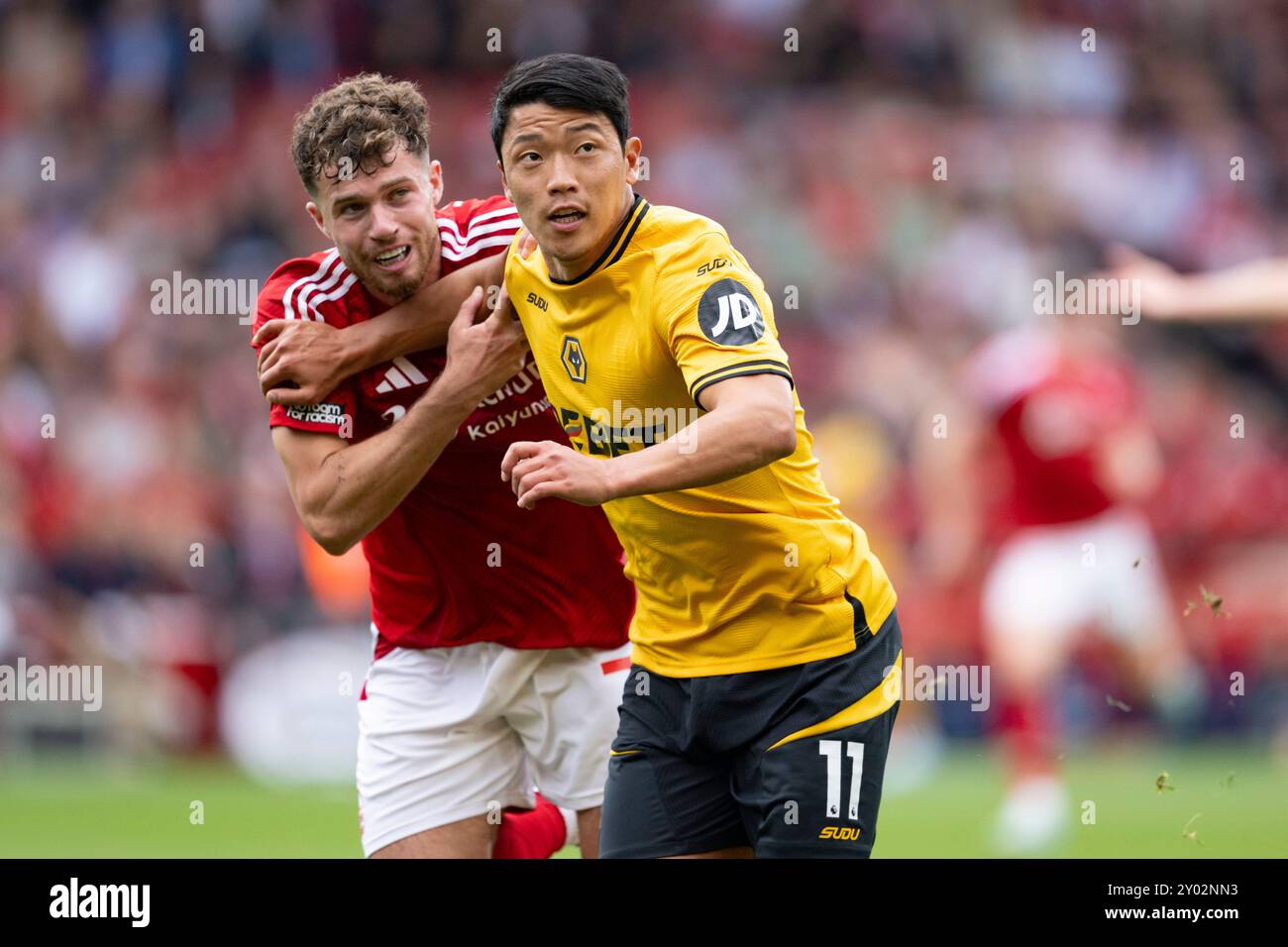 NOTTINGHAM, ENGLAND - AUGUST 31: Hwang Hee-Chan of Wolves (R) fights for position with Neco Williams of Nottingham Forest (L) during the Premier League football match between Nottingham Forest and Wolverhampton Wanderers at the City Ground Stadium on August 31, 2024 in Nottingham, England. (Photo by Richard Callis/SPP) (Richard Callis/SPP) Credit: SPP Sport Press Photo. /Alamy Live News Stock Photo