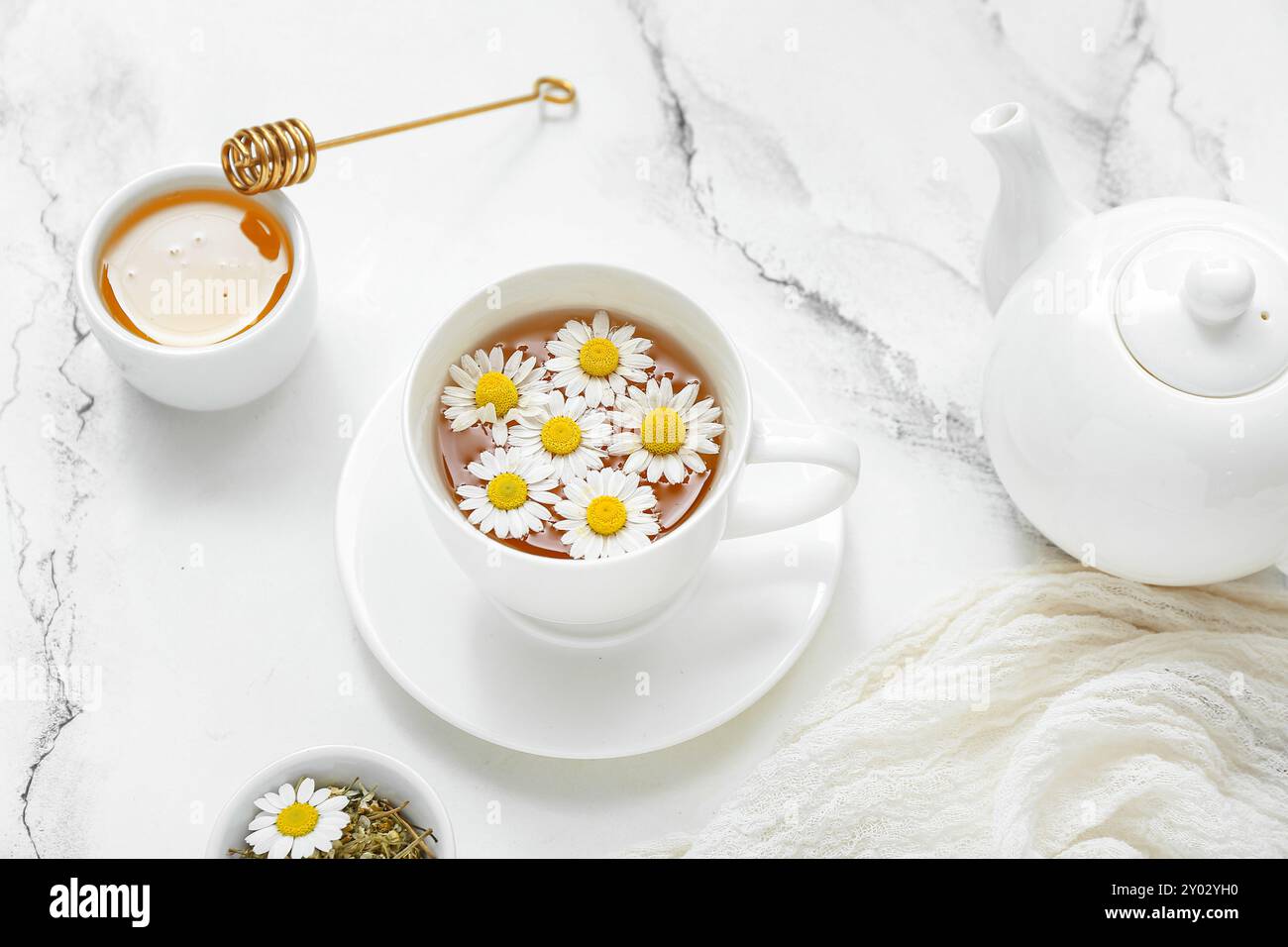 Cup of hot chamomile tea and honey on white marble background Stock ...