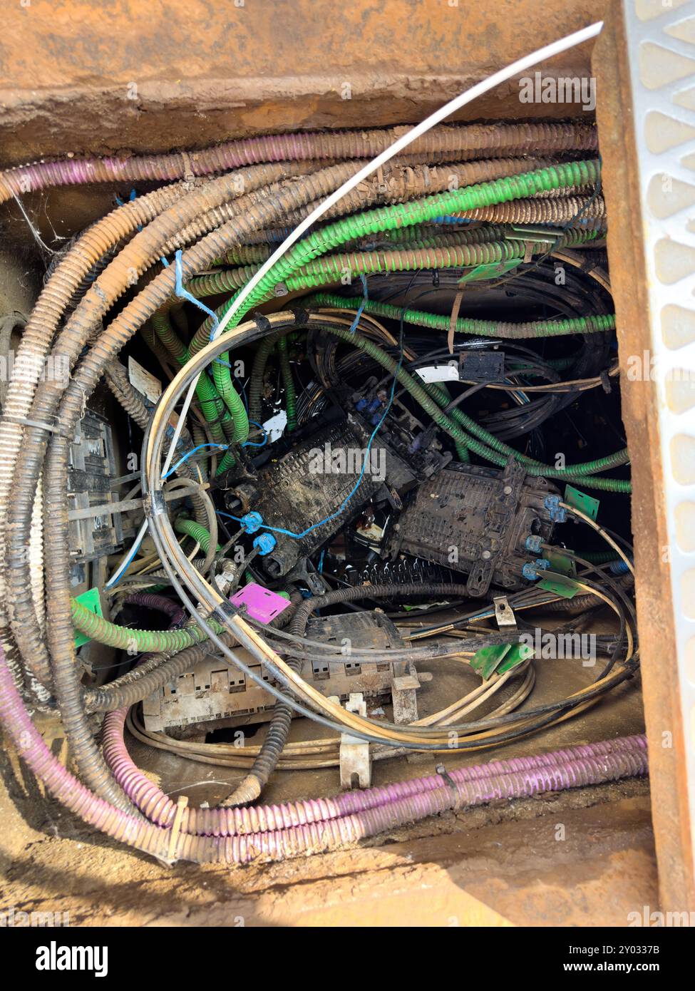 A water-filled canalization with multiple cables, including fiber optic ...