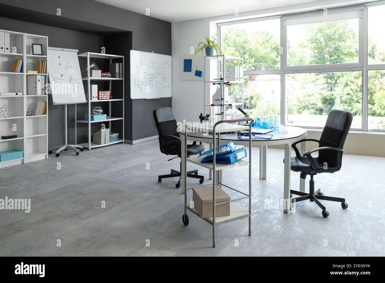 Interior of laboratory with workplace and shelf units Stock Photo - Alamy