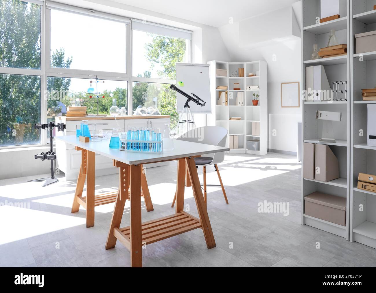 Interior of laboratory with workplace, shelf units and chemical ...