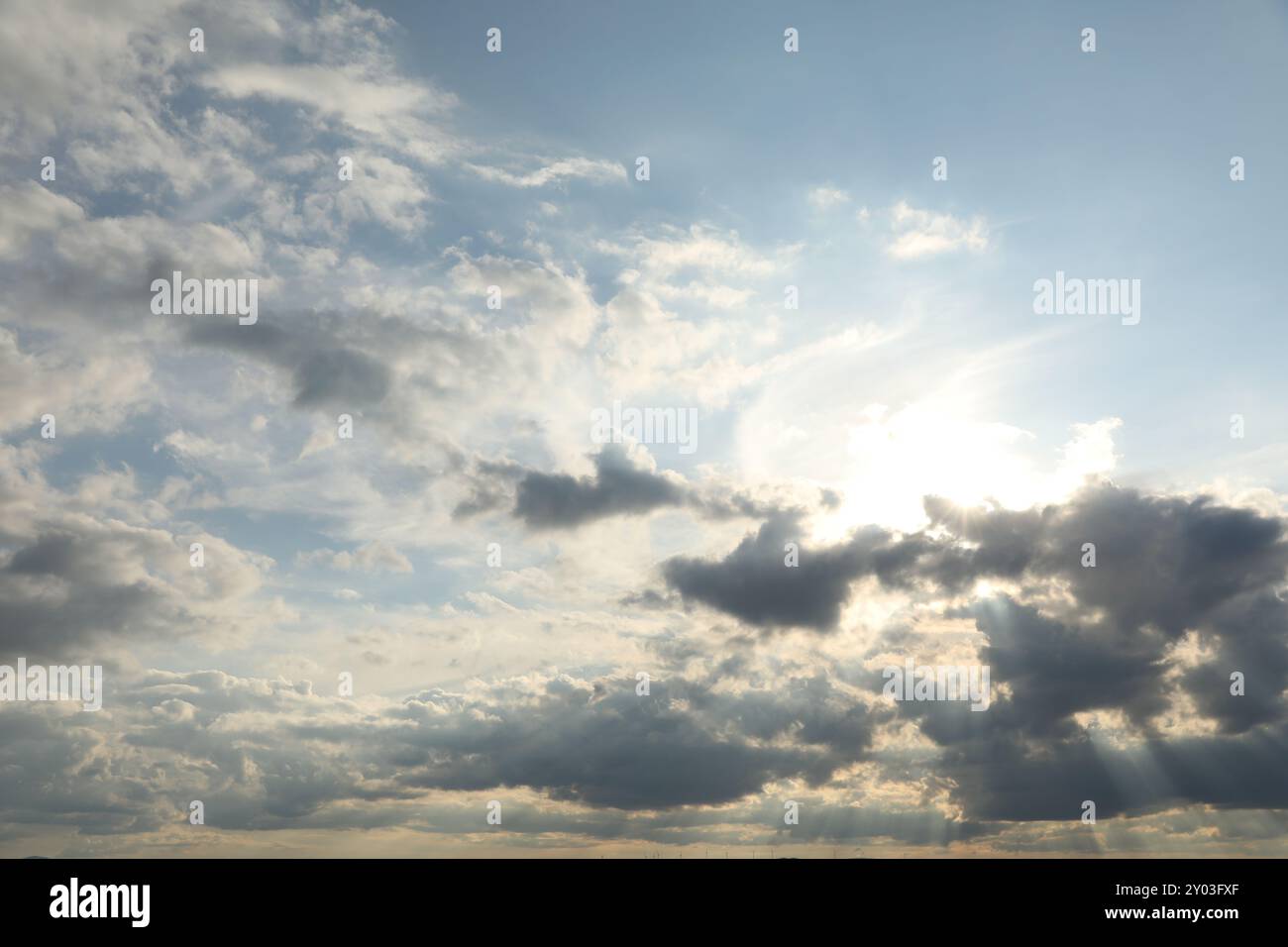 Sun shining through clouds on beautiful sky Stock Photo - Alamy