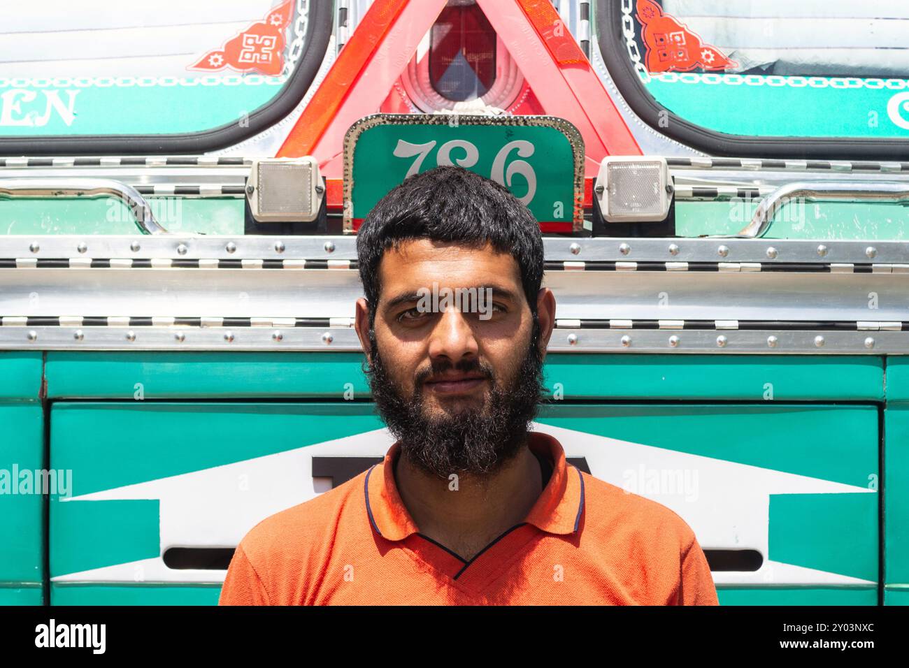 Bearded truck driver poses in front of his vehicle, India Stock Photo ...