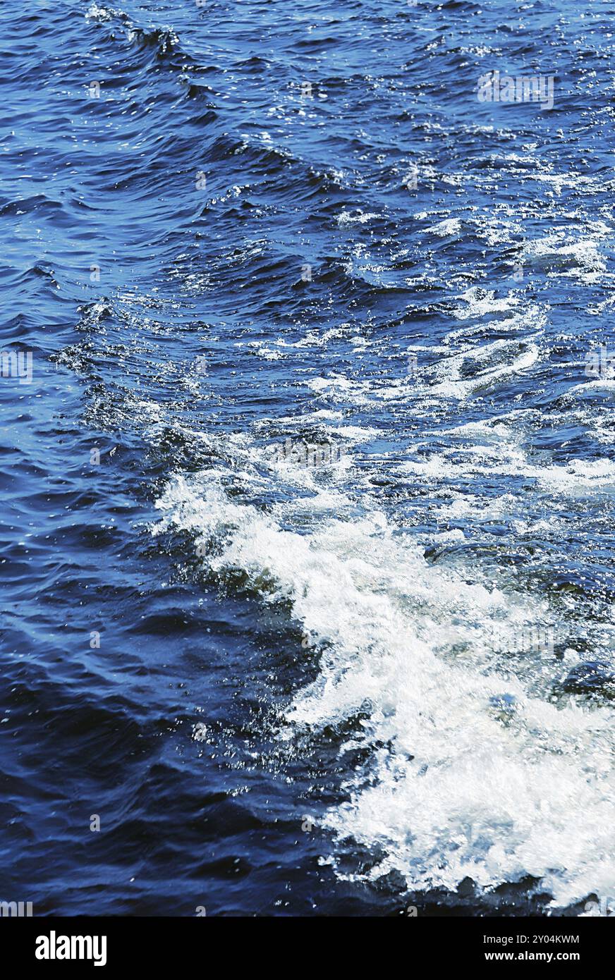 Blue water texture with white wave Stock Photo - Alamy