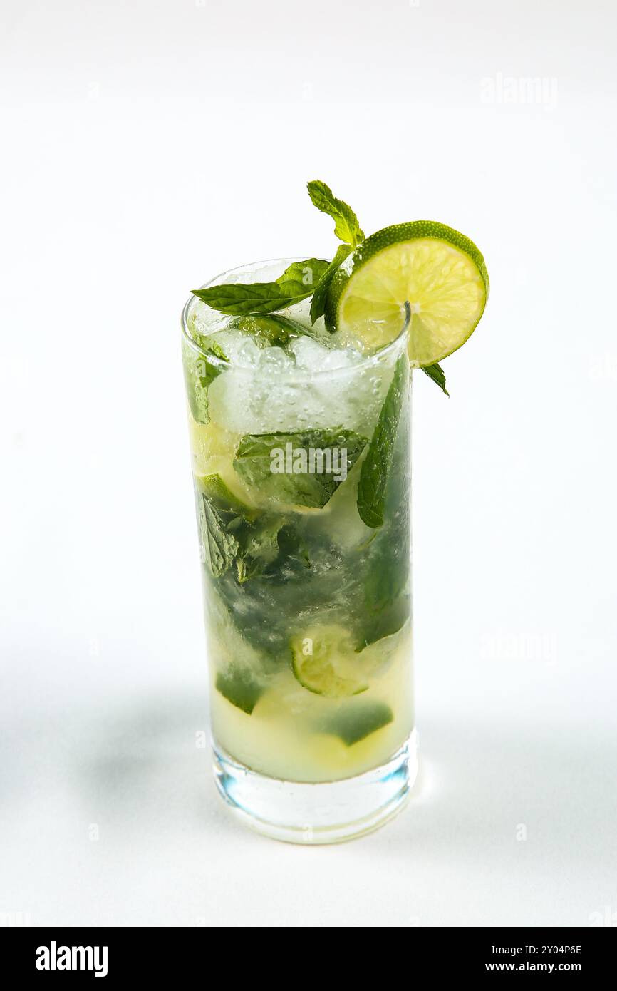 Refreshment Lime juice with mint on white table. Stock Photo