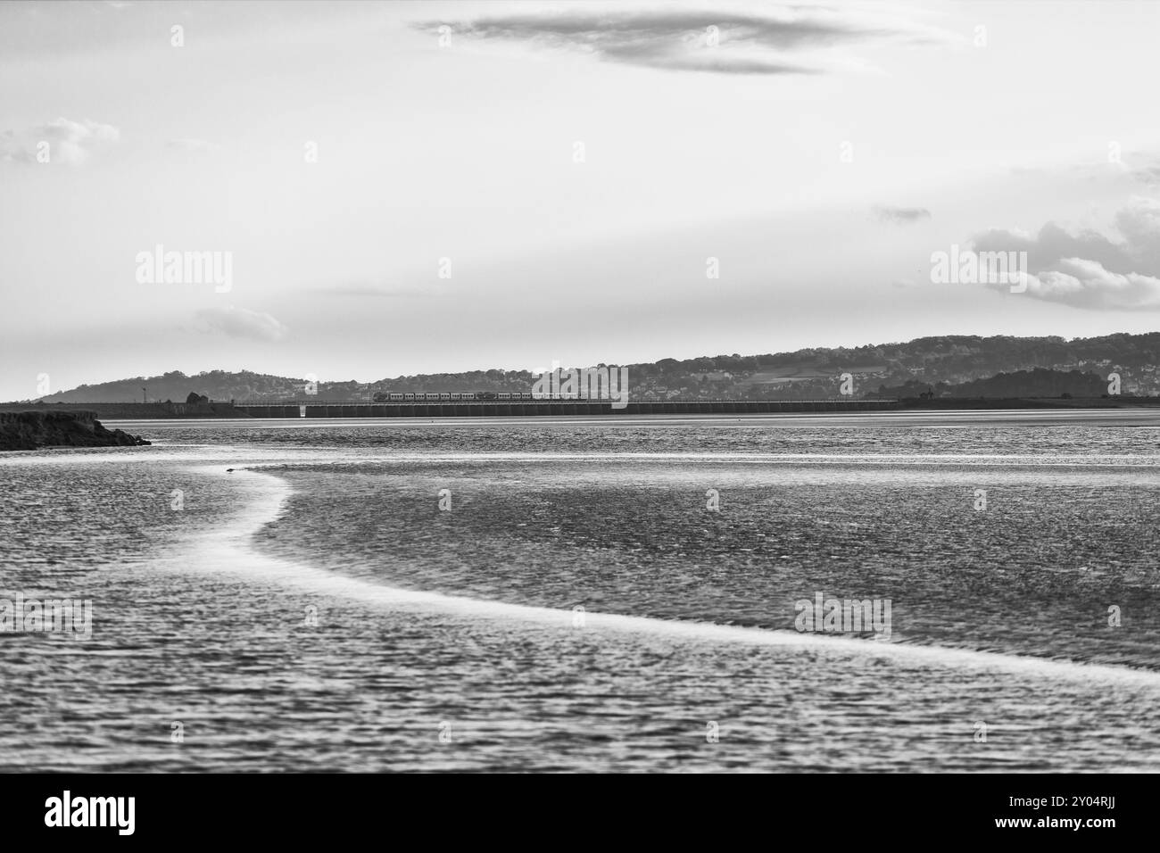 Northern rail CAF class195 train crossing Arnside viaduct across the river Kent estuary on the scenic Cumbrian coast railway line Stock Photo