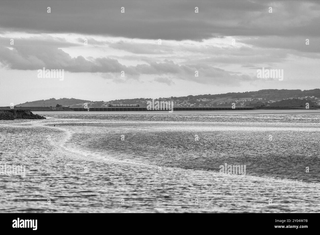 Northern rail CAF class195 train crossing Arnside viaduct across the river Kent estuary on the scenic Cumbrian coast railway line Stock Photo