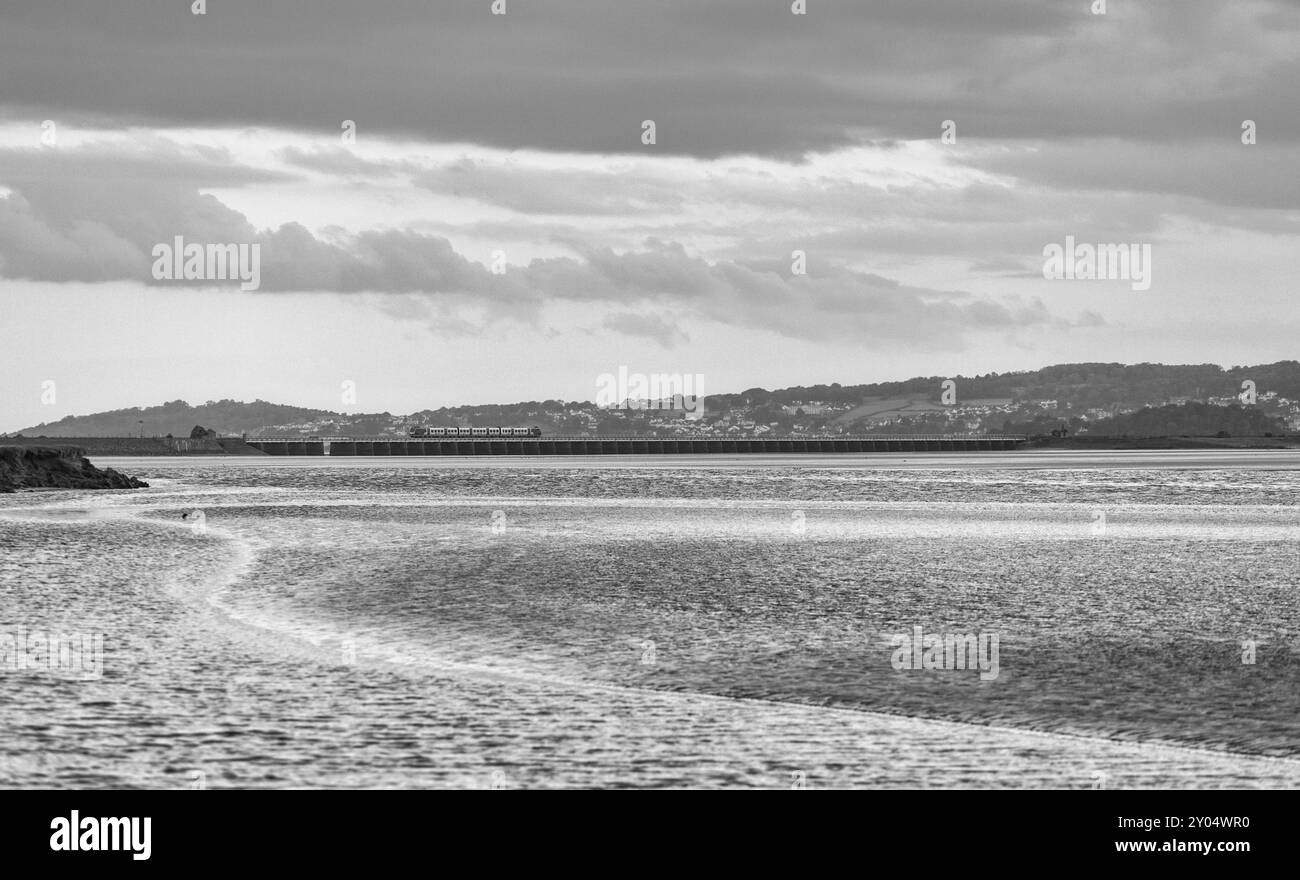 Northern rail CAF class195 train crossing Arnside viaduct across the river Kent estuary on the scenic Cumbrian coast railway line Stock Photo