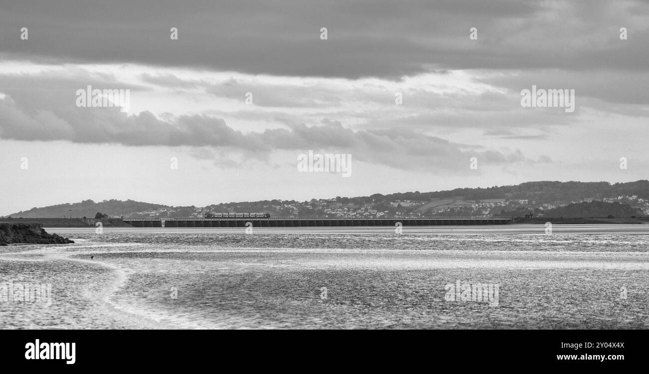 Northern rail CAF class195 train crossing Arnside viaduct across the river Kent estuary on the scenic Cumbrian coast railway line Stock Photo