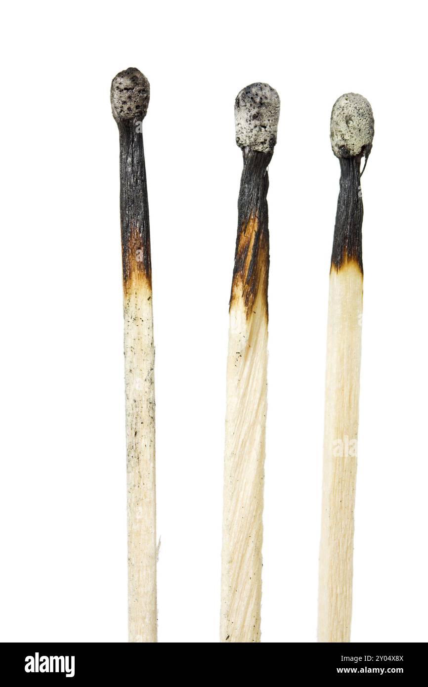 Three burned matches isolated on white background Stock Photo