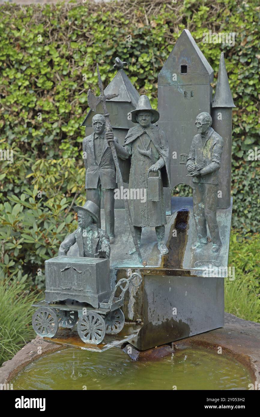 Historian's fountain with figures on the town's history, four, sculptures, bronze, barrel organ player, night watchman, lance, fountain, Zell am Harme Stock Photo