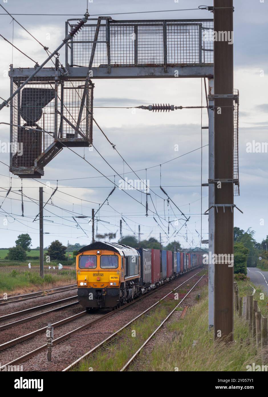 GB Railfreight ( GBRF ) class 66 diesel locomotive 66769 hauling a intermodal container train on the east coast mainline passing Drem, Scotland Stock Photo