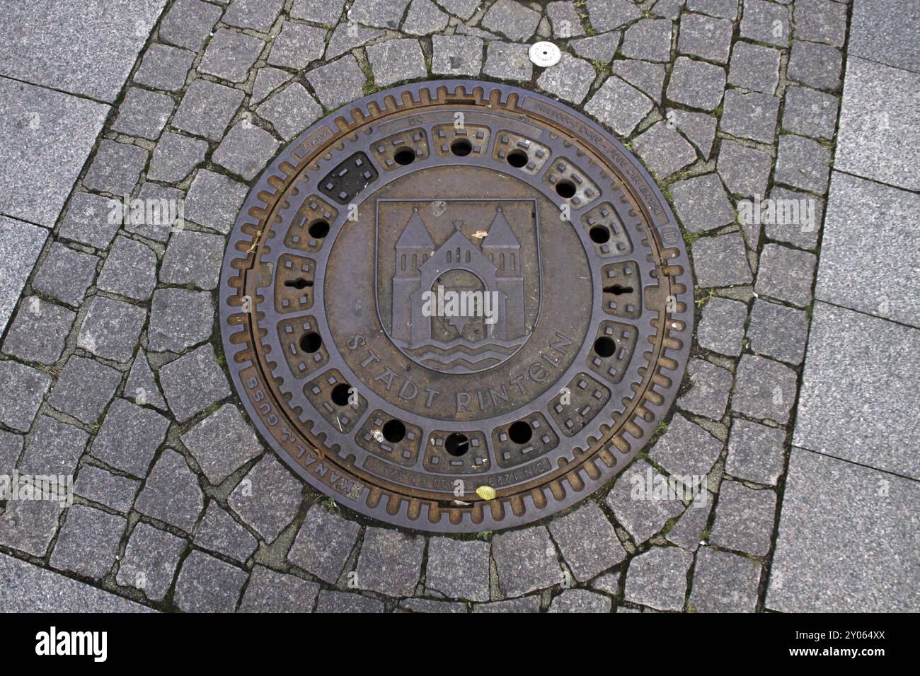 Manhole cover with city coat of arms in Rinteln Stock Photo