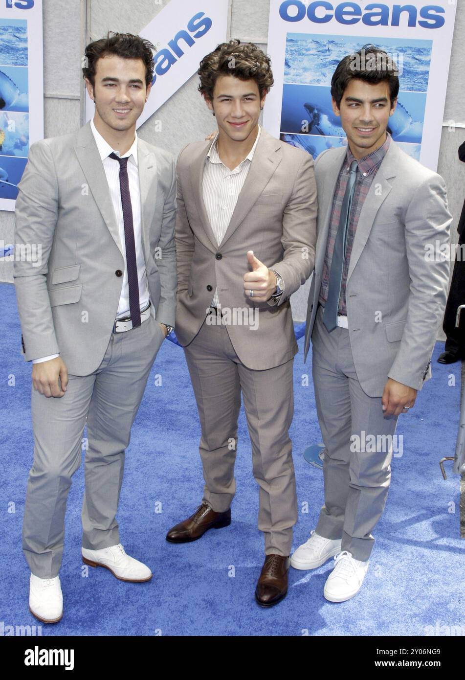 Nick Jonas, Kevin Jonas and Joe Jonas of The Jonas Brothers at the Los Angeles premiere of 'Oceans' held at the El Capitan Theater in Hollywood, USA o Stock Photo