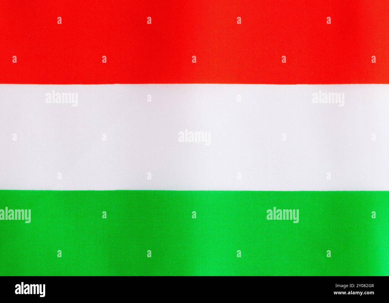 Flat Hungary Fabric Flag Background Close Up. Stock Photo