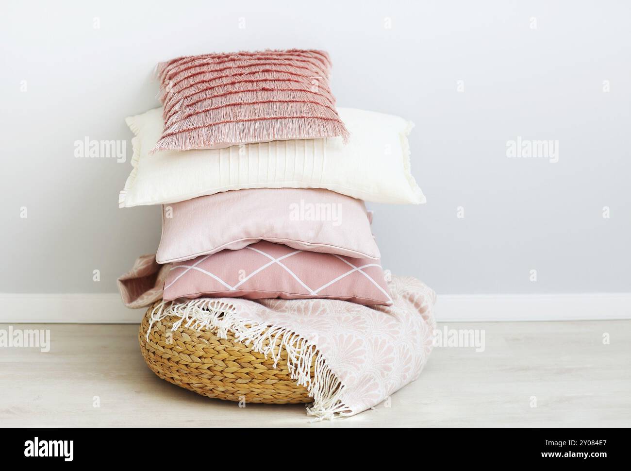 Pink and white pillows on the wall background. Close up Stock Photo