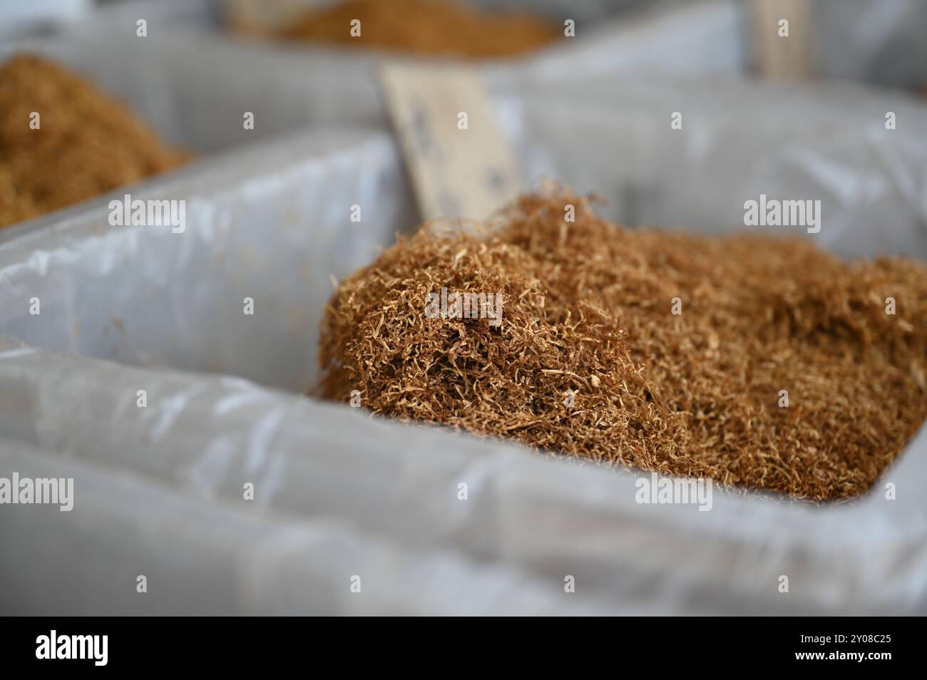 Peking, China. 01st Sep, 2024. There is loose tobacco in a box at a market stall. Credit: Johannes Neudecker/dpa/Alamy Live News Stock Photo