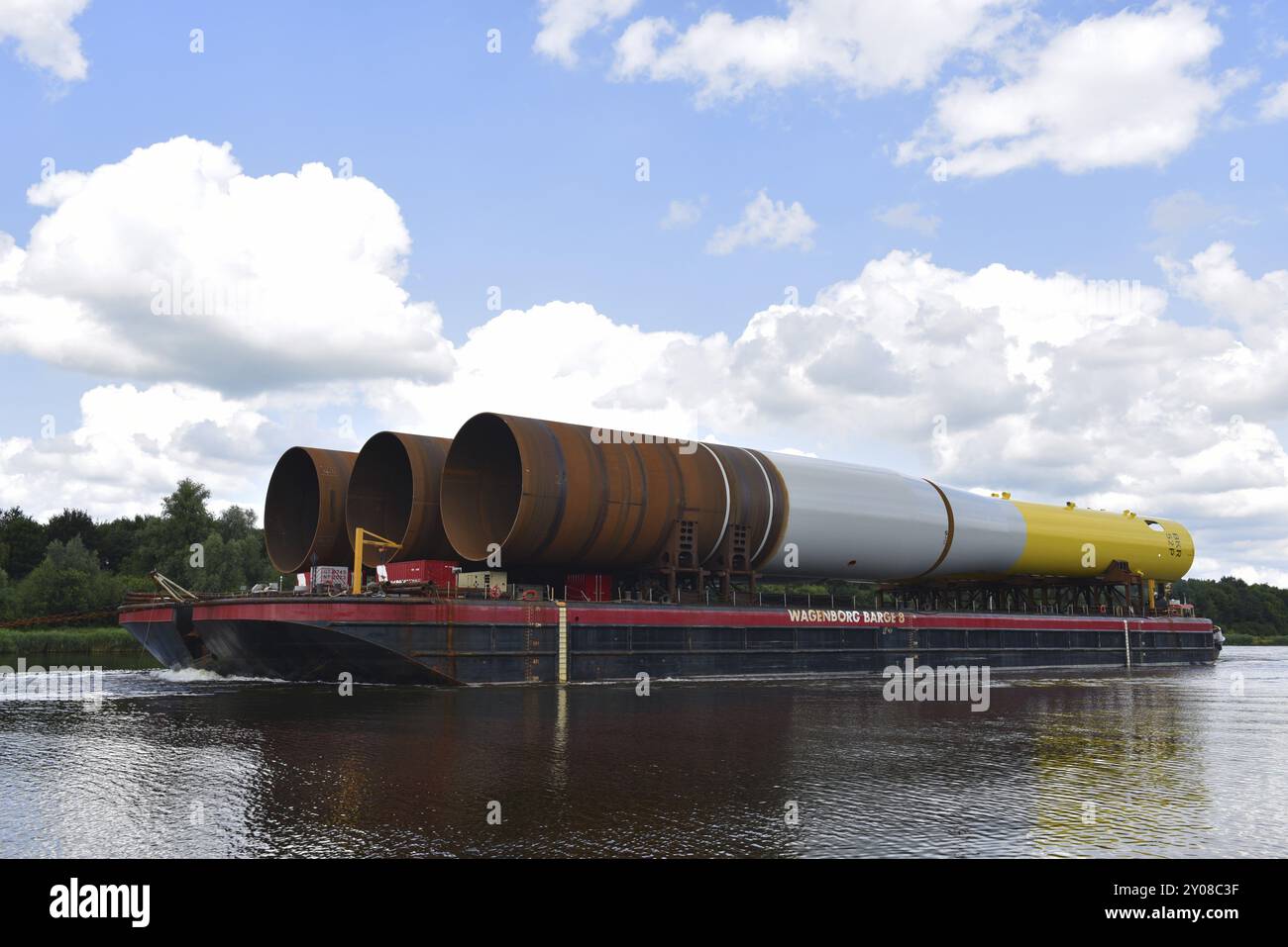 Tugboat pulling parts of an offshore wind turbine through