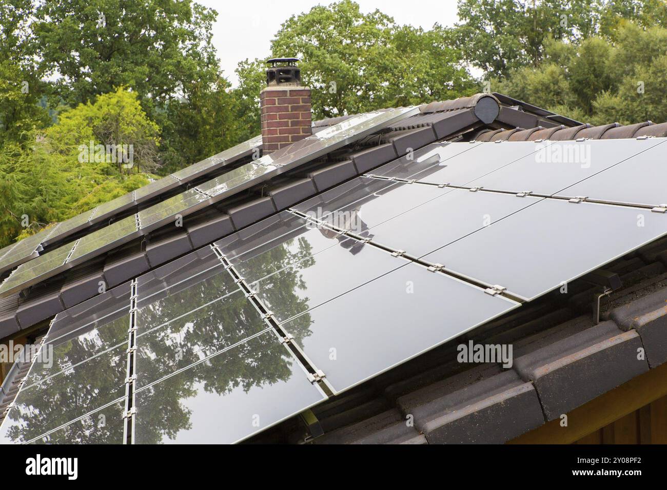 Roof surface of home with black solar collectors Stock Photo - Alamy