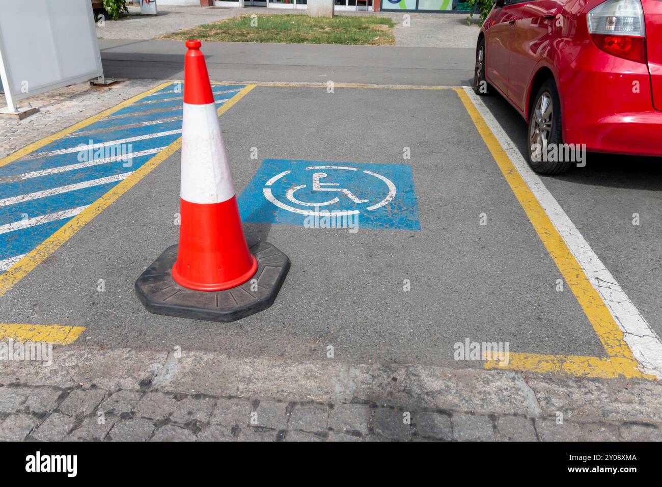 Parking only for disabled drivers. Free Parking space for PWD; indicated by road markings and information sign. Adapted spaces for disabled person. In Stock Photo