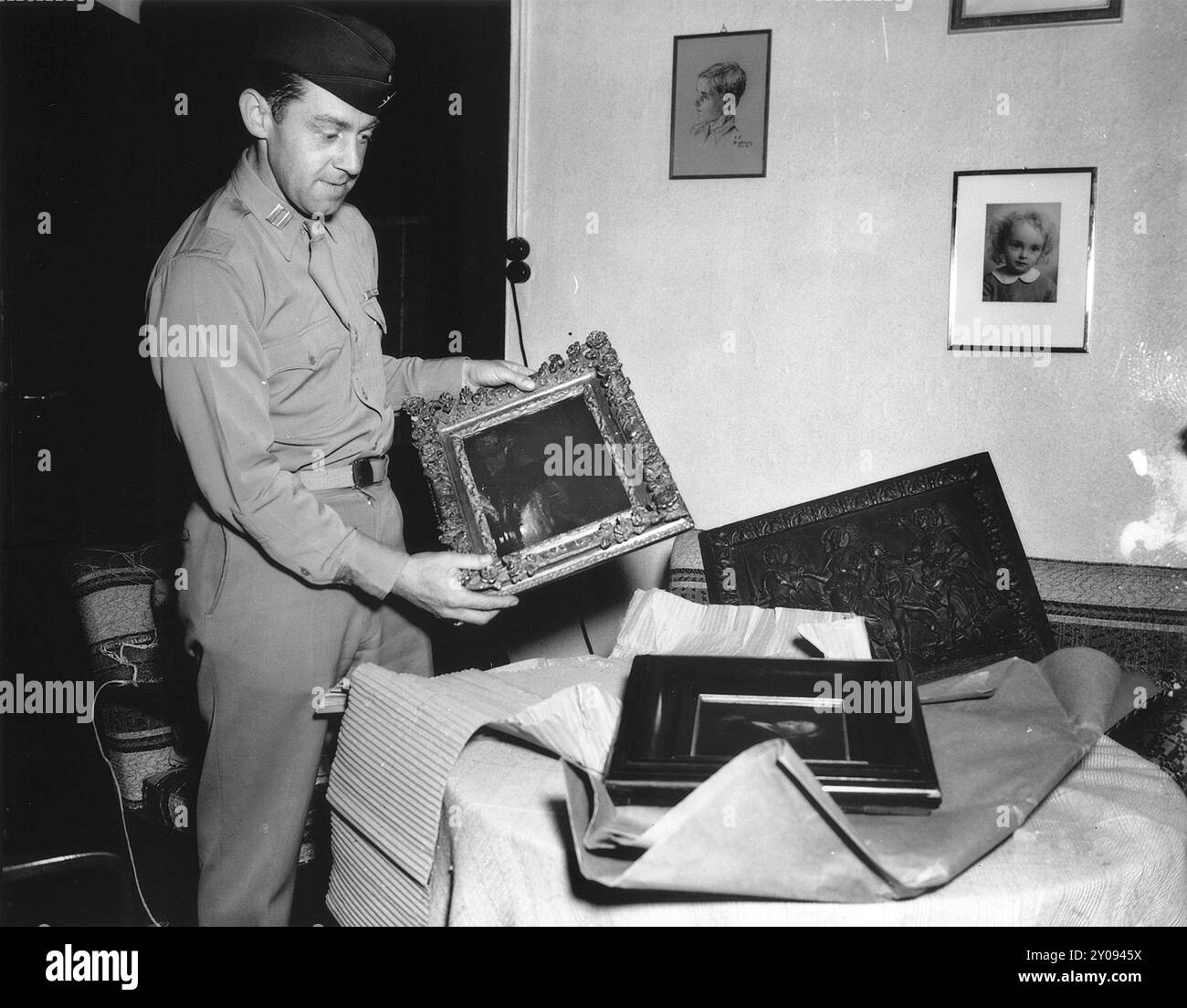 a-us-soldier-opens-packages-containing-art-work-looted-by-the-nazis-for
